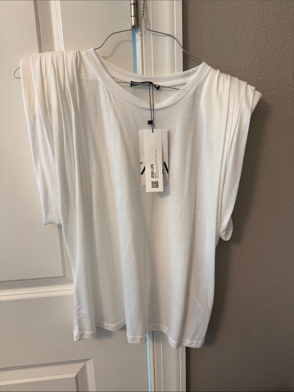White Sleeveless Draped Shoulder Top with shoulder pads